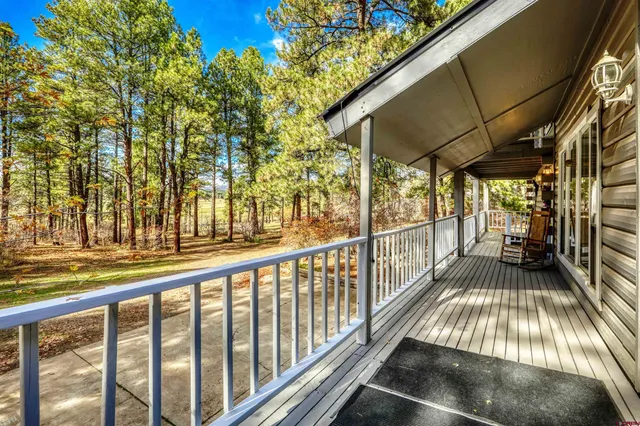 a view of balcony with wooden floor and outdoor space