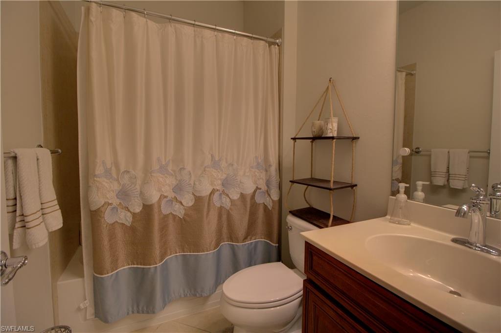 8615 Palermo Court Naples, FL 34114 - Photo 19 of 50 a bathroom with a sink a toilet and shower