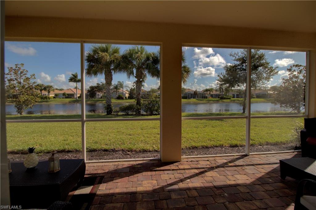 8615 Palermo Court Naples, FL 34114 - Photo 2 of 50 a view of a street with a large window