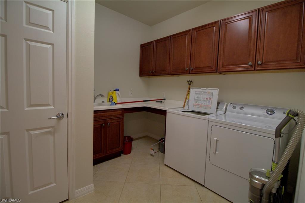 8615 Palermo Court Naples, FL 34114 - Photo 22 of 50 a utility room with dryer and washer