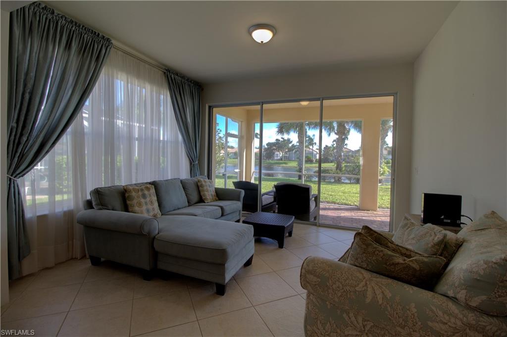 8615 Palermo Court Naples, FL 34114 - Photo 7 of 50 a living room with furniture and a flat screen tv