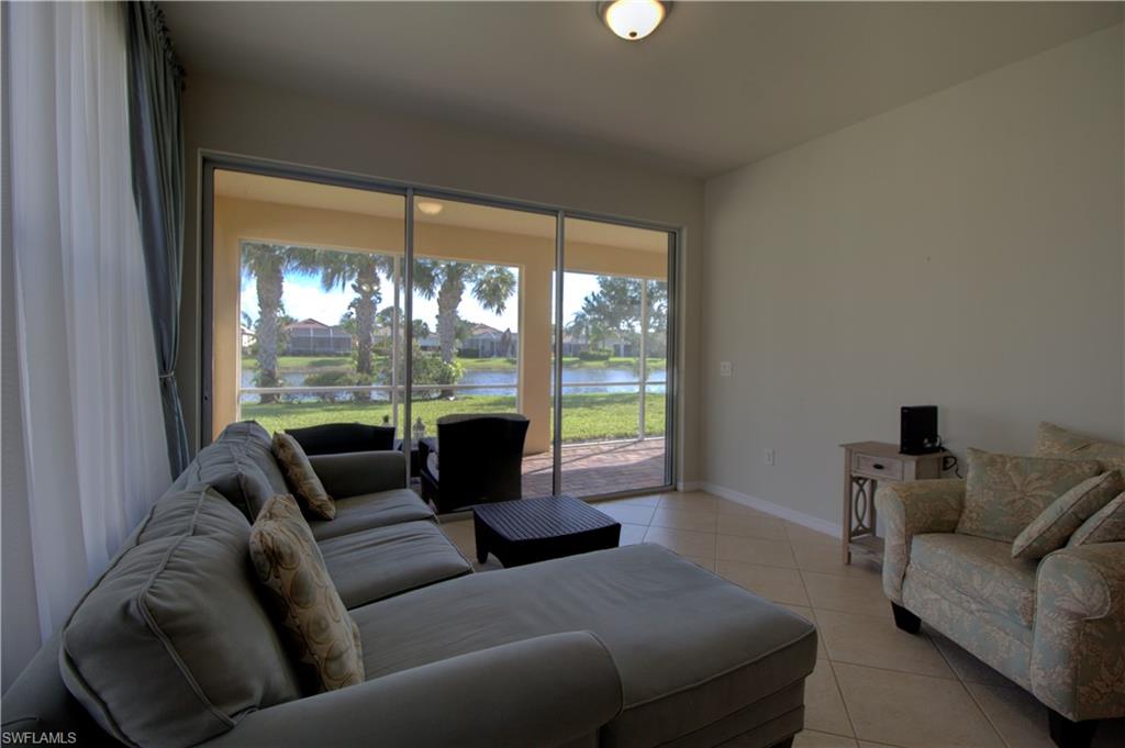 8615 Palermo Court Naples, FL 34114 - Photo 8 of 50 a living room with furniture and a large window