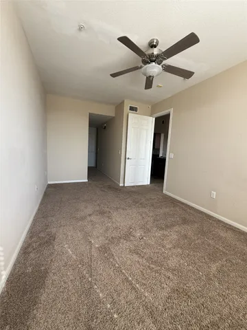 a spacious bathroom with a bathtub shower sink mirror and toilet