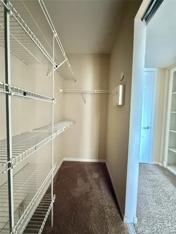 a view of swimming pool with outdoor seating and lake view