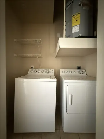 a view of roof deck with a barbeque and wooden stairs