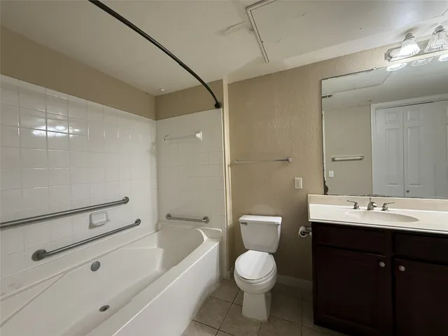 a kitchen with stainless steel appliances granite countertop a refrigerator stove and microwave