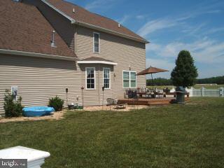 7965 Richardson Road Willards, MD 21874 - Photo 2 of 13 a front view of house with yard