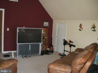 7965 Richardson Road Willards, MD 21874 - Photo 12 of 13 a room with furniture and a flat screen tv