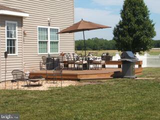 7965 Richardson Road Willards, MD 21874 - Photo 8 of 13 a house view with swimming pool and sitting space