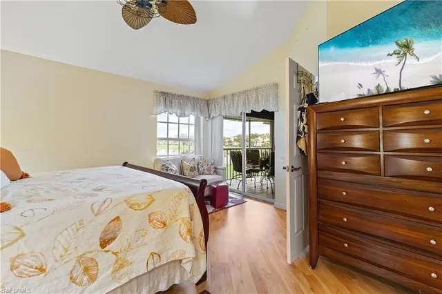 a bed room with a bed and chair