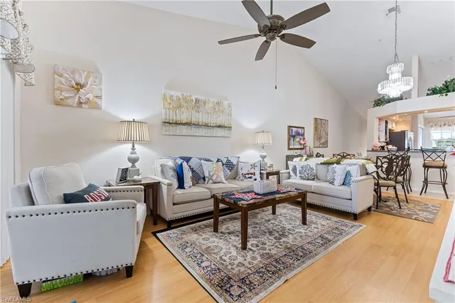 a living room with furniture and a rug