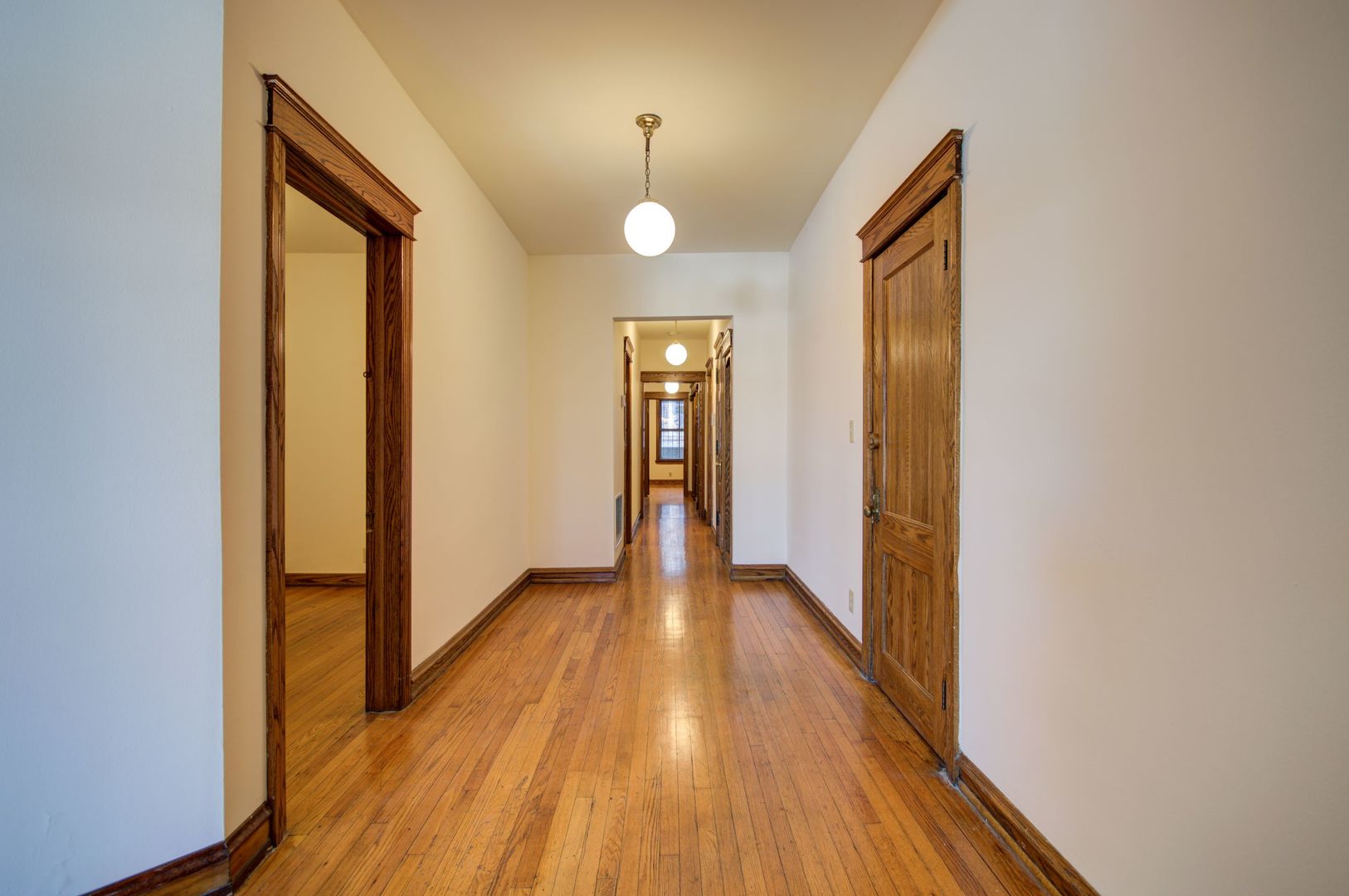 845 West Sheridan Road, Unit 1 Chicago, IL 60613 - Photo 6 of 17 a view of a hallway with wooden floor and staircase
