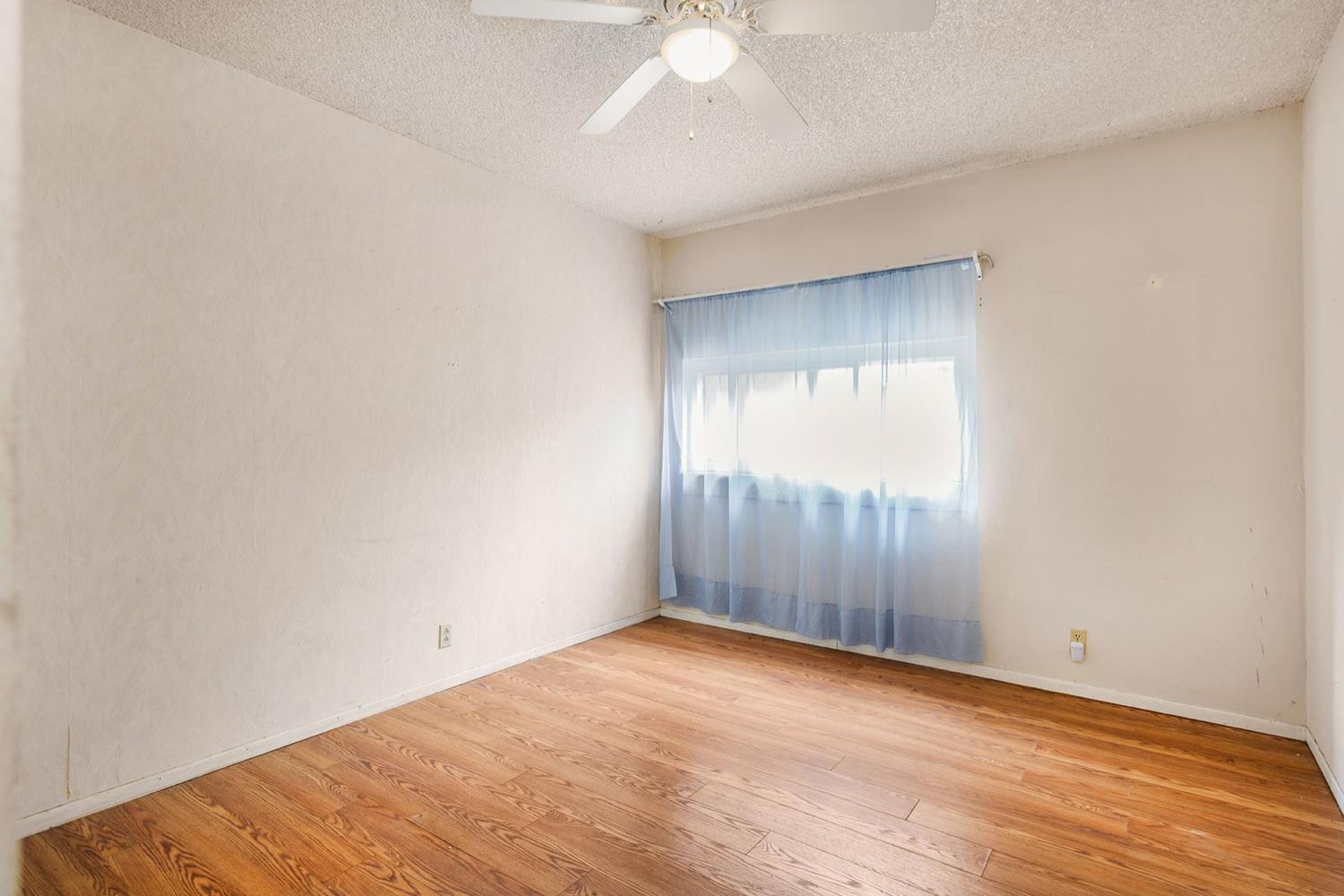 982 Oso Road Ojai, CA 93023 - Photo 11 of 21 an empty room with wooden floor and windows