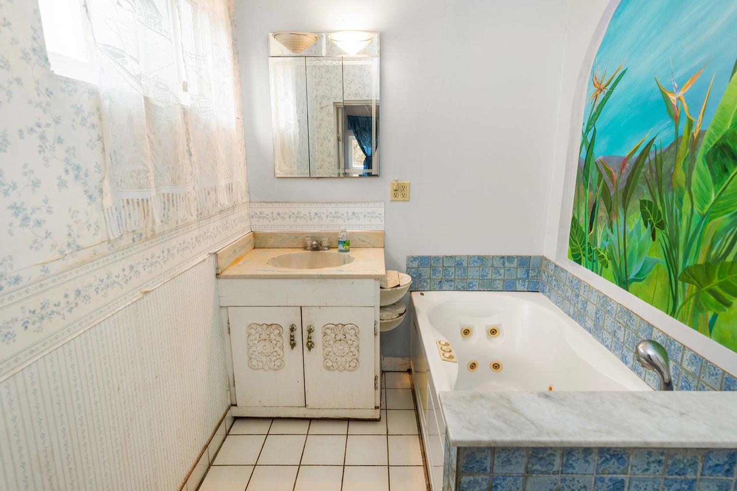 982 Oso Road Ojai, CA 93023 - Photo 14 of 21 a bathroom with a sink and a bathtub