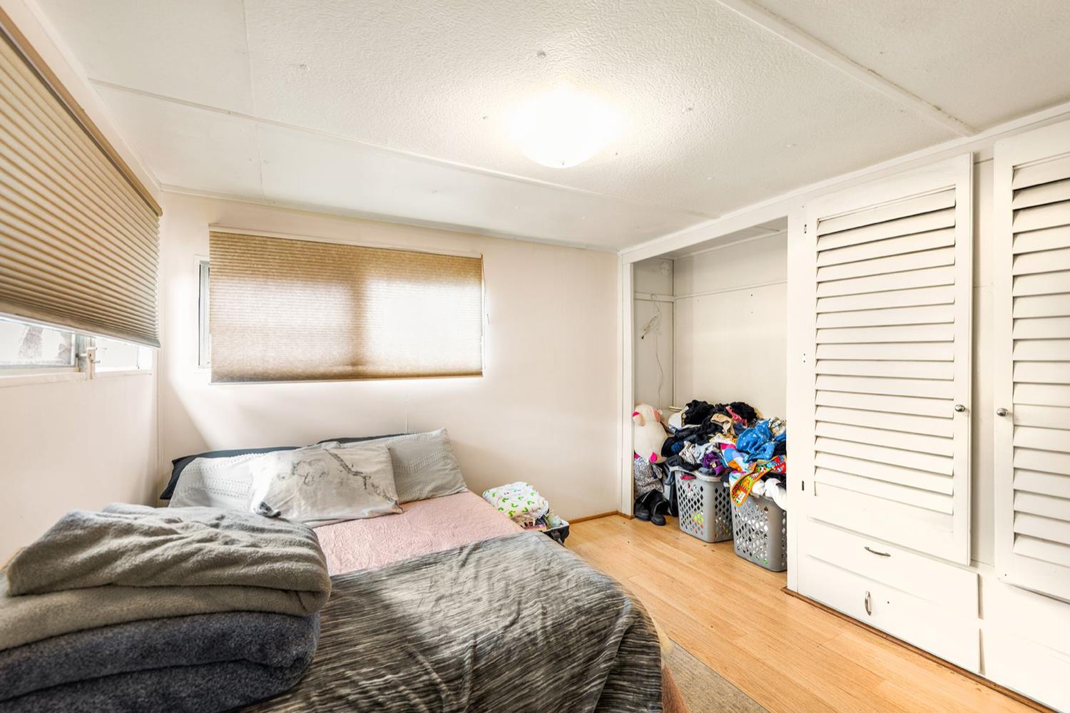 982 Oso Road Ojai, CA 93023 - Photo 18 of 21 a bedroom with a bed and a window