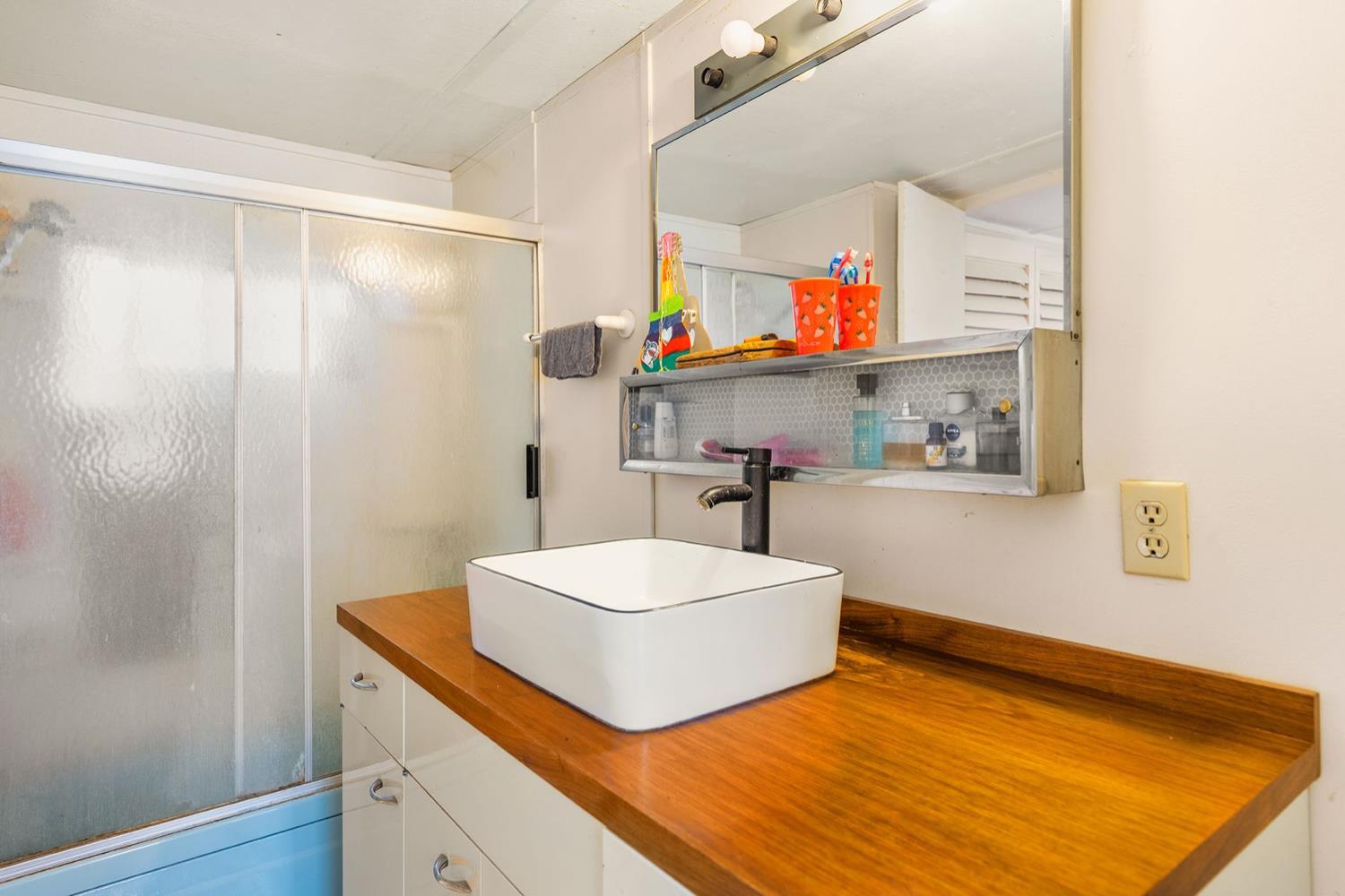 982 Oso Road Ojai, CA 93023 - Photo 19 of 21 a room with a sink and a wooden floor