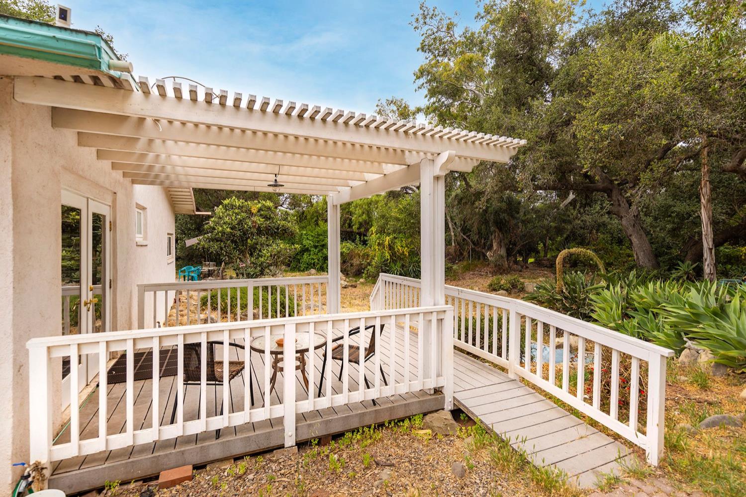 982 Oso Road Ojai, CA 93023 - Photo 4 of 21 a view of a wooden deck and a backyard