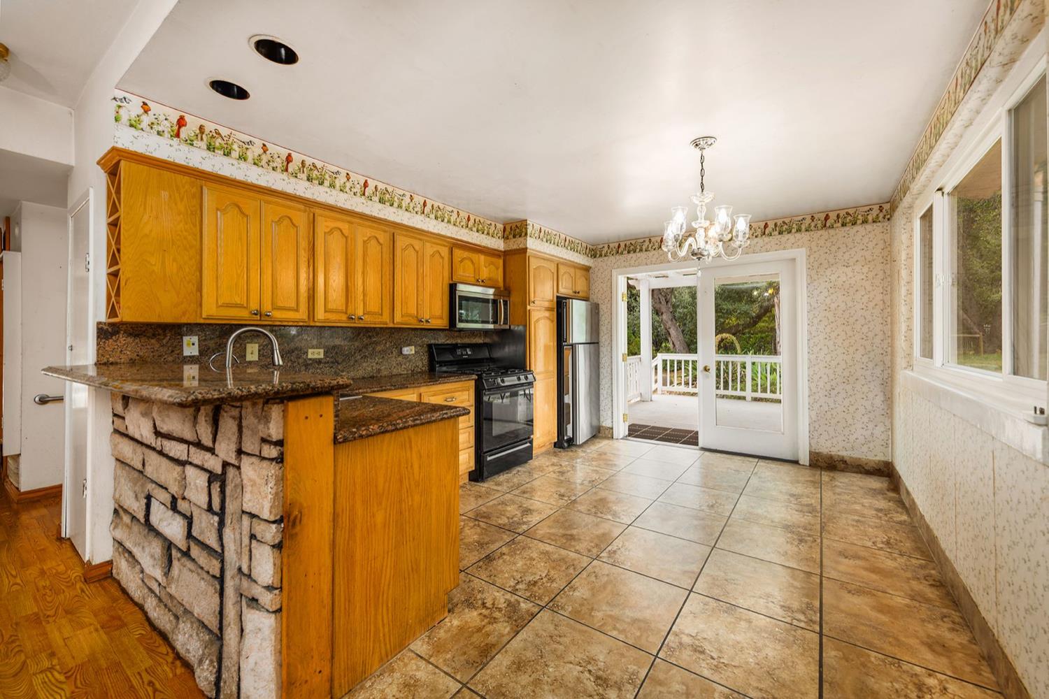982 Oso Road Ojai, CA 93023 - Photo 7 of 21 a view of a kitchen with a sink and a window