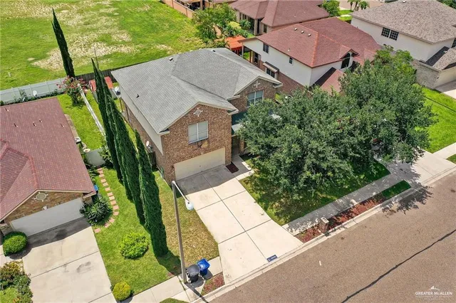 an aerial view of house with yard