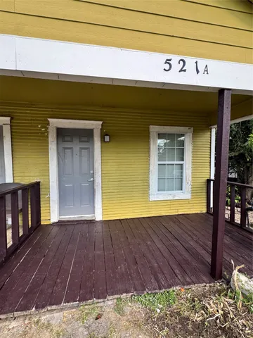 a view of backyard with wooden floor