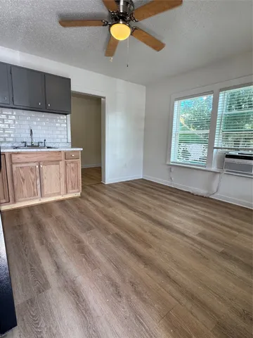 a view of a kitchen with a sink and a window