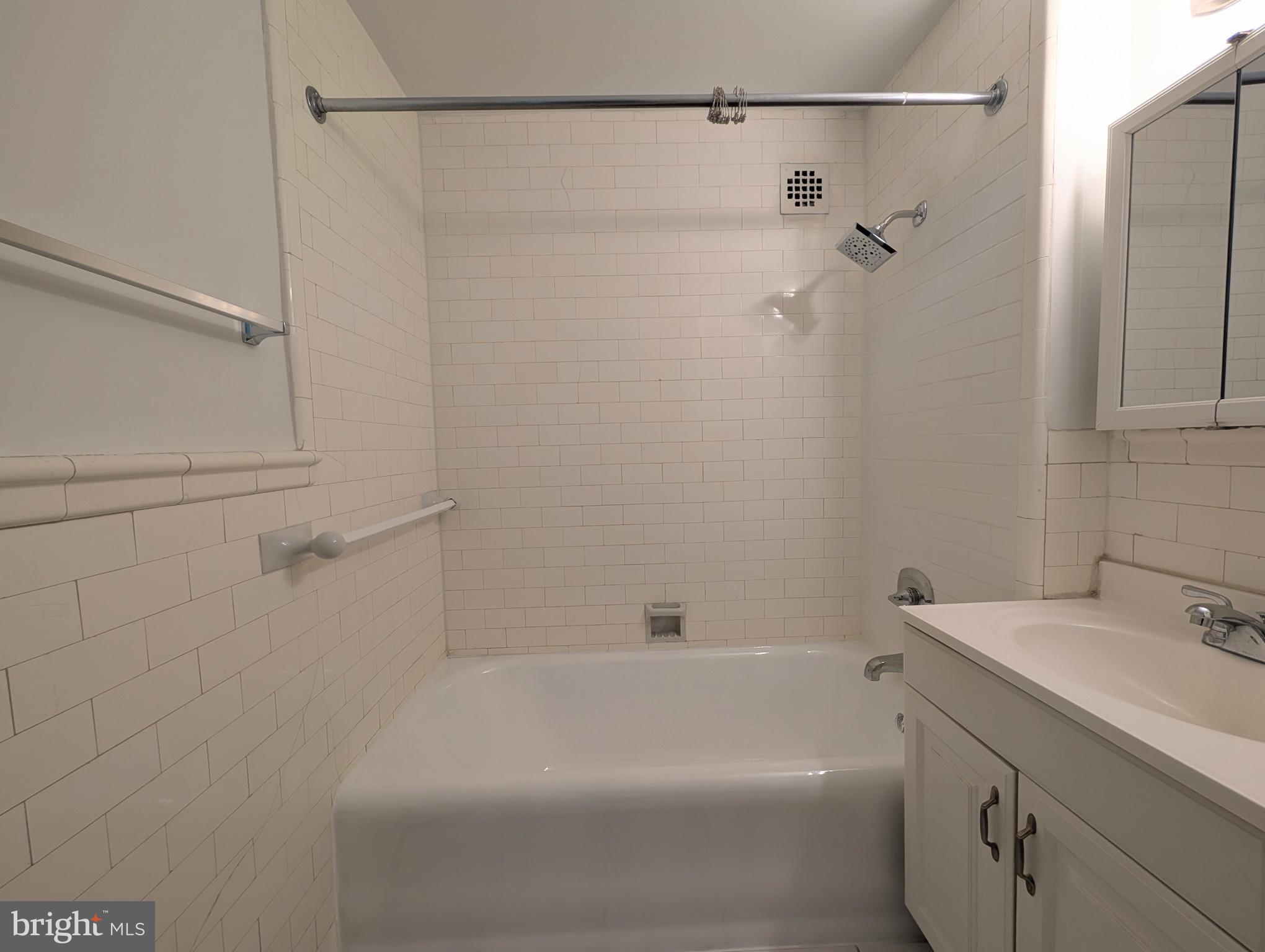 1324 Locust Street, Unit 618 Philadelphia, PA 19107 - Photo 14 of 34 a bathroom with a shower and a sink