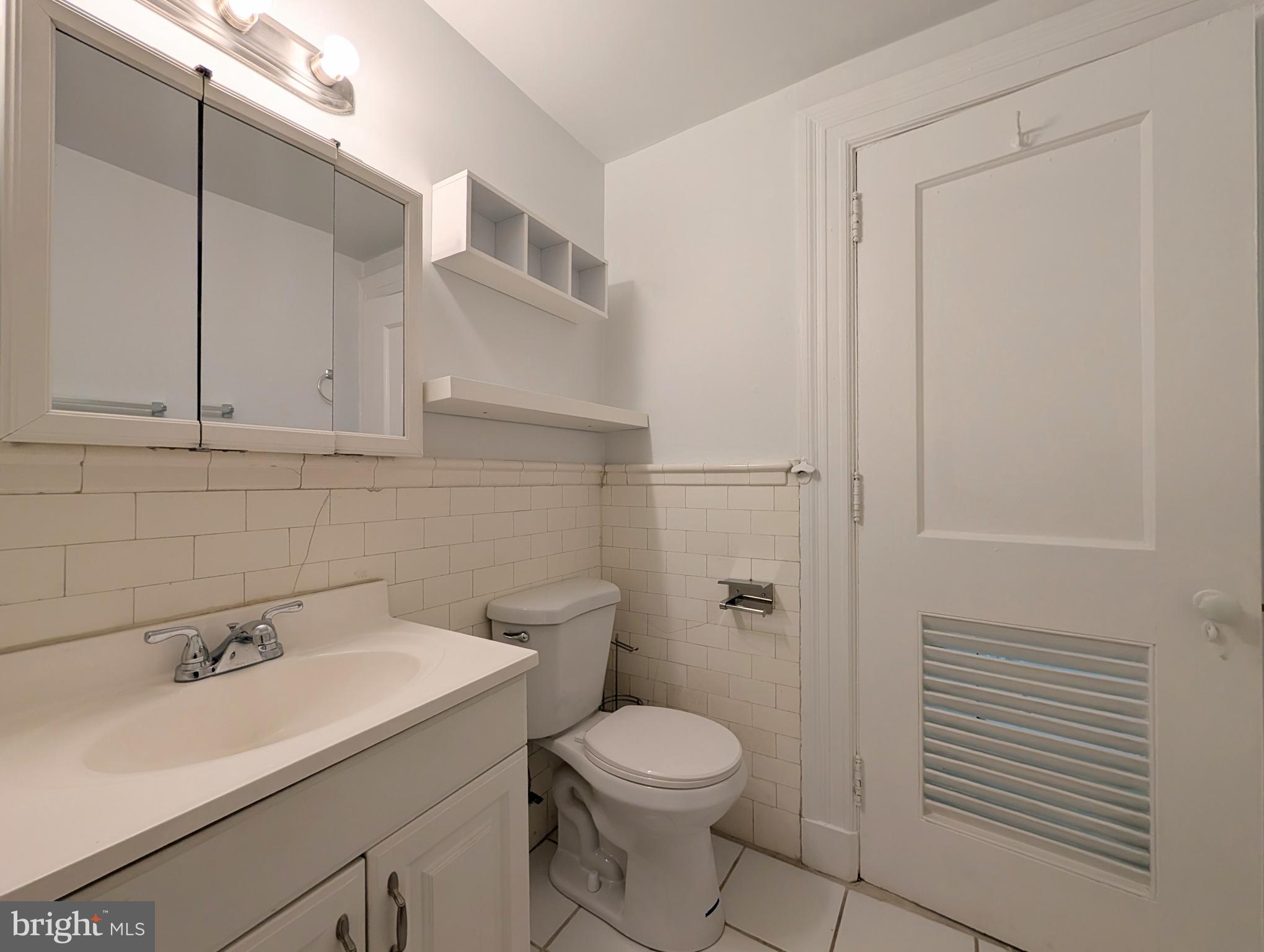 1324 Locust Street, Unit 618 Philadelphia, PA 19107 - Photo 15 of 34 a bathroom with a sink a toilet and shower