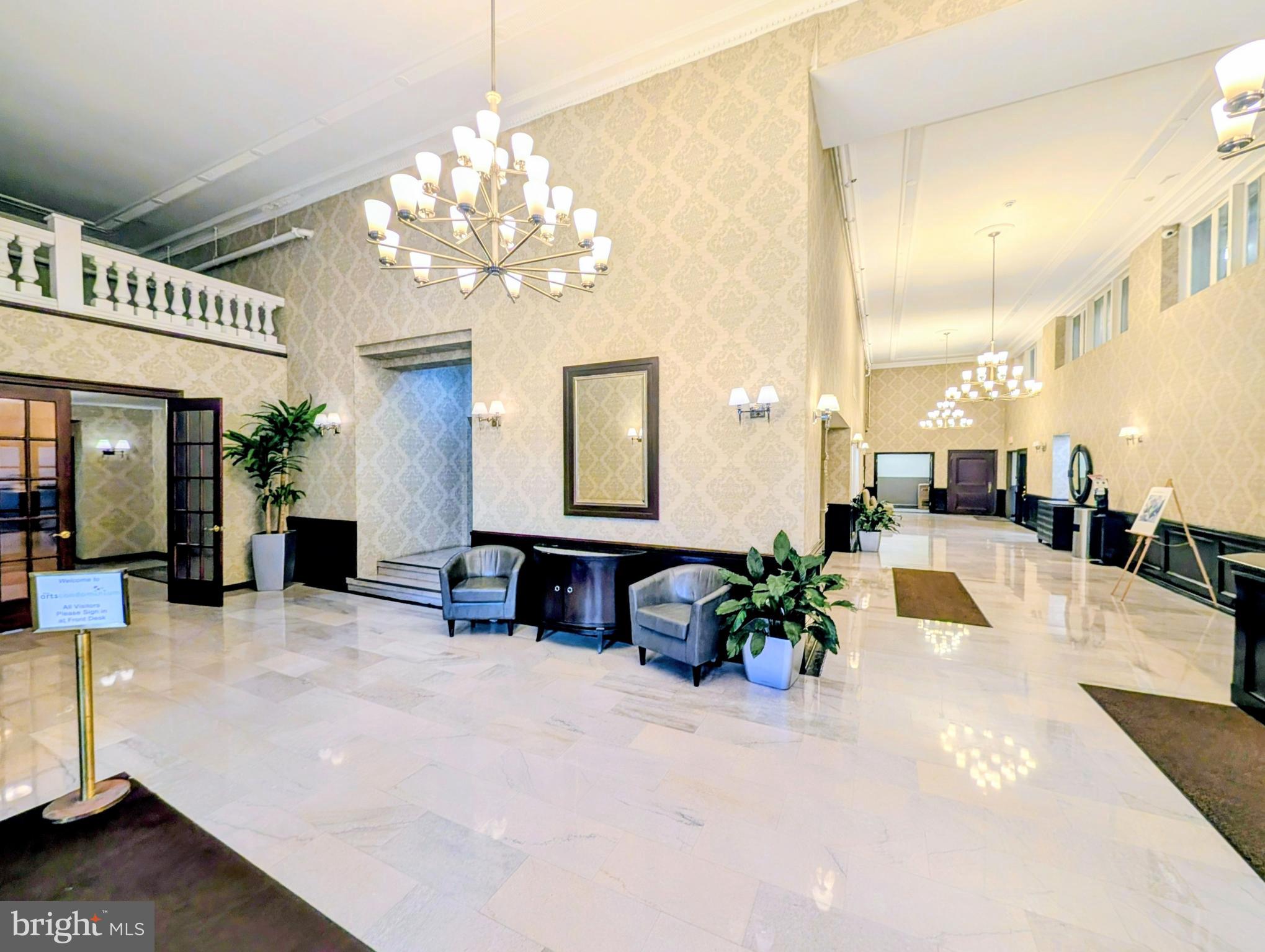 1324 Locust Street, Unit 618 Philadelphia, PA 19107 - Photo 20 of 34 a lobby with furniture and a chandelier