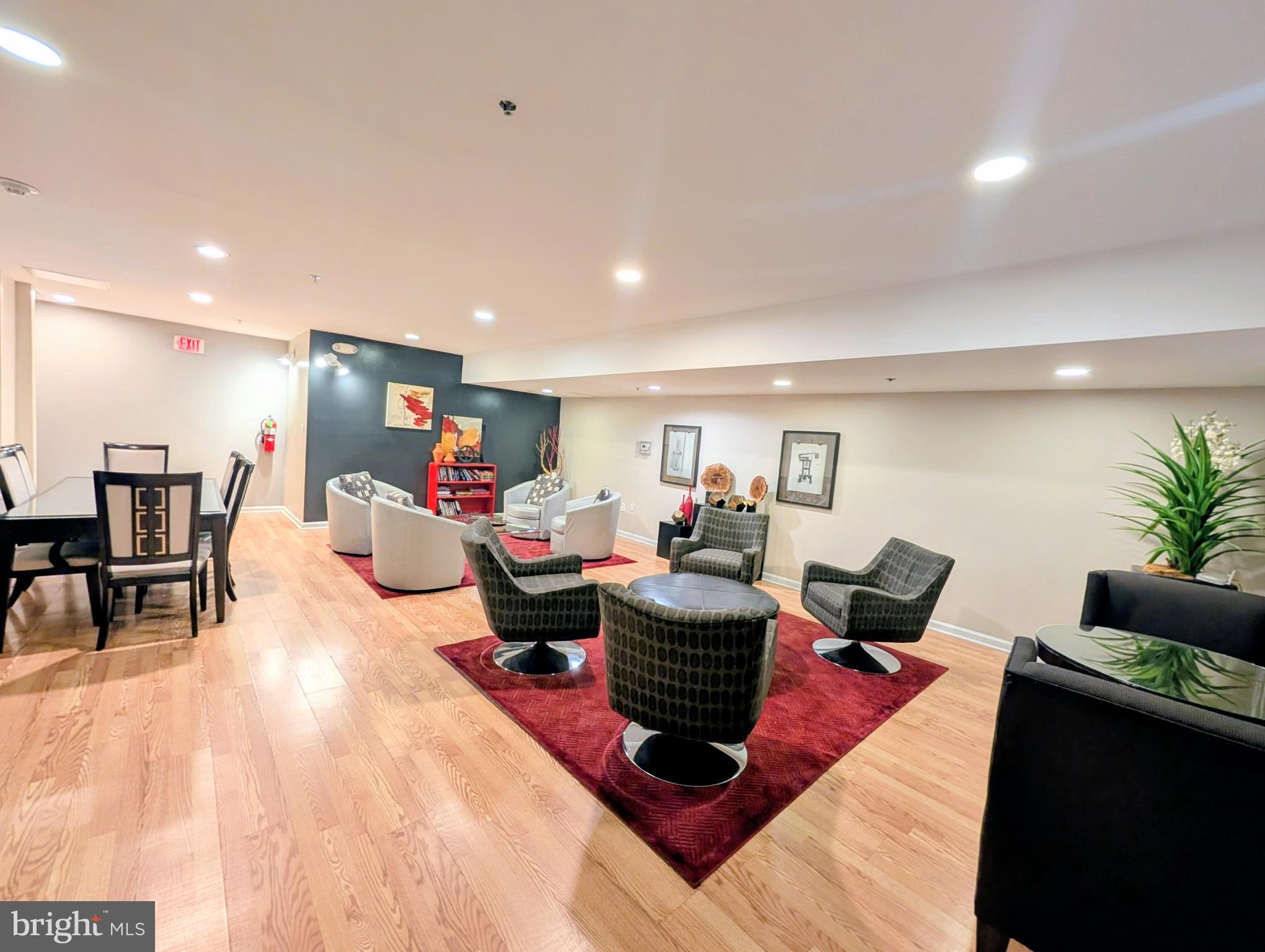 1324 Locust Street, Unit 618 Philadelphia, PA 19107 - Photo 27 of 34 a living room with furniture and a flat screen tv