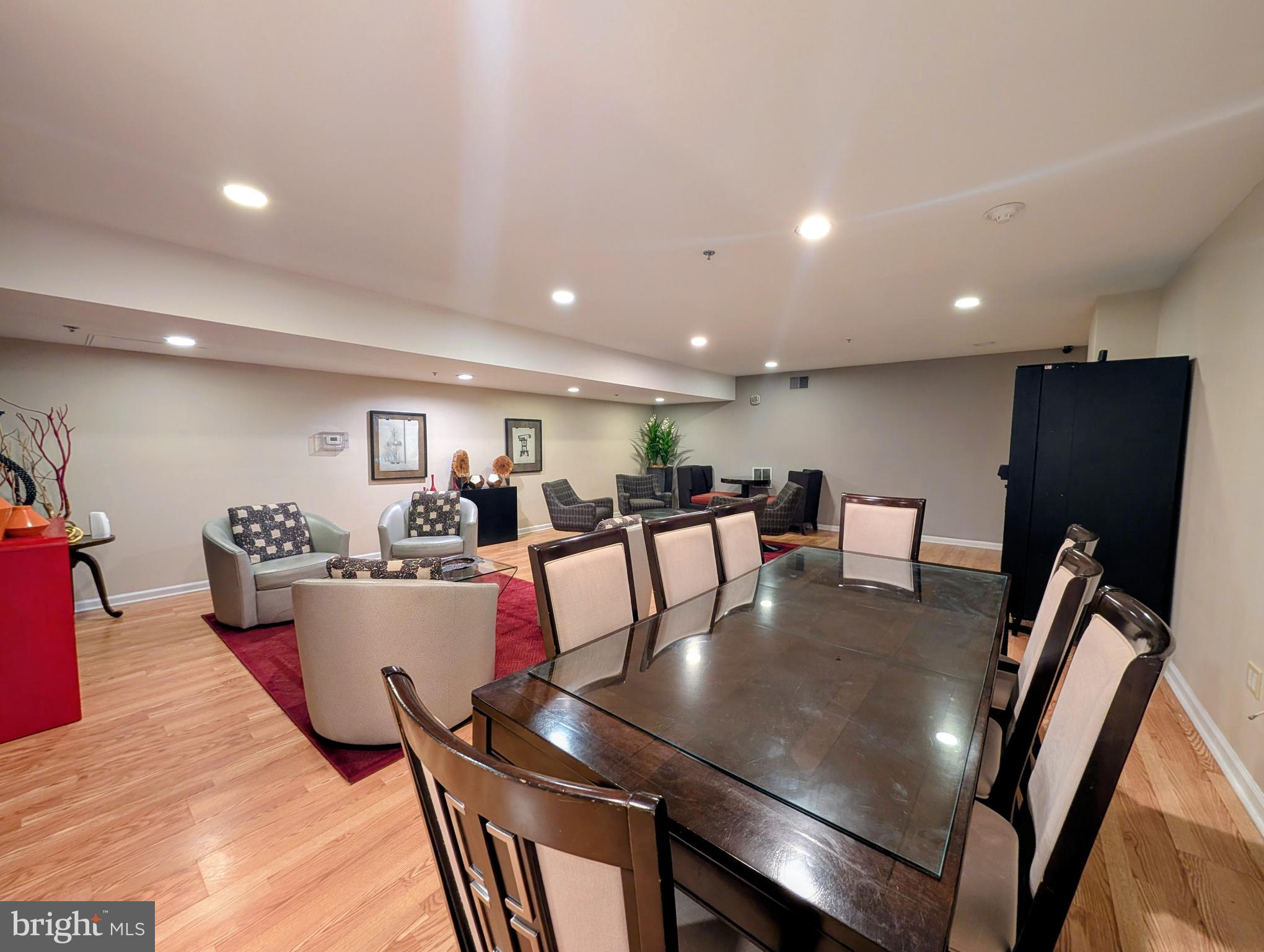 1324 Locust Street, Unit 618 Philadelphia, PA 19107 - Photo 28 of 34 a living room with dining room and wooden floor