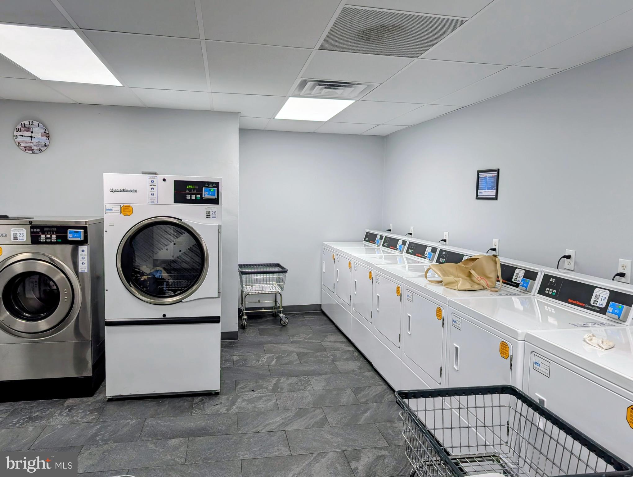 1324 Locust Street, Unit 618 Philadelphia, PA 19107 - Photo 33 of 34 a utility room with dryer and washer
