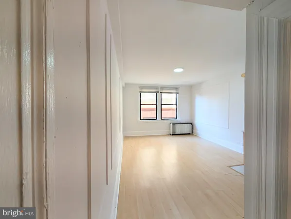 a view of an empty room and window