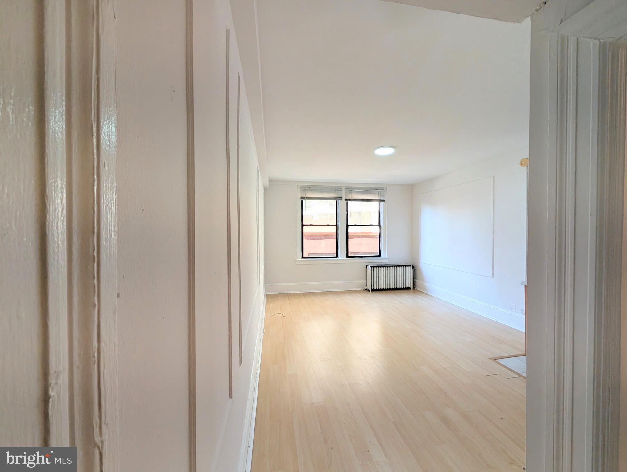1324 Locust Street, Unit 618 Philadelphia, PA 19107 - Photo 8 of 34 a view of an empty room and window