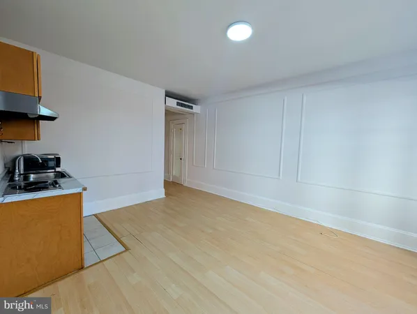 a kitchen with granite countertop a sink and a stove top oven