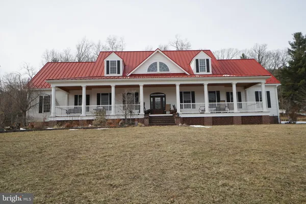 a front view of a house with swimming pool