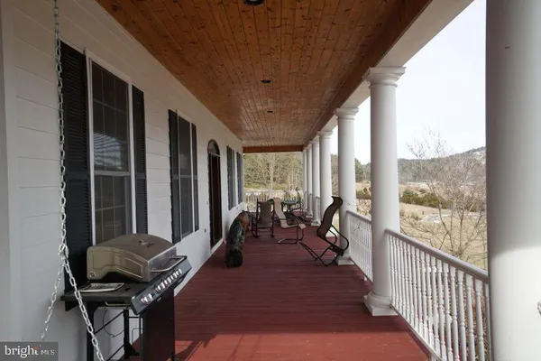 a view of a balcony and chairs