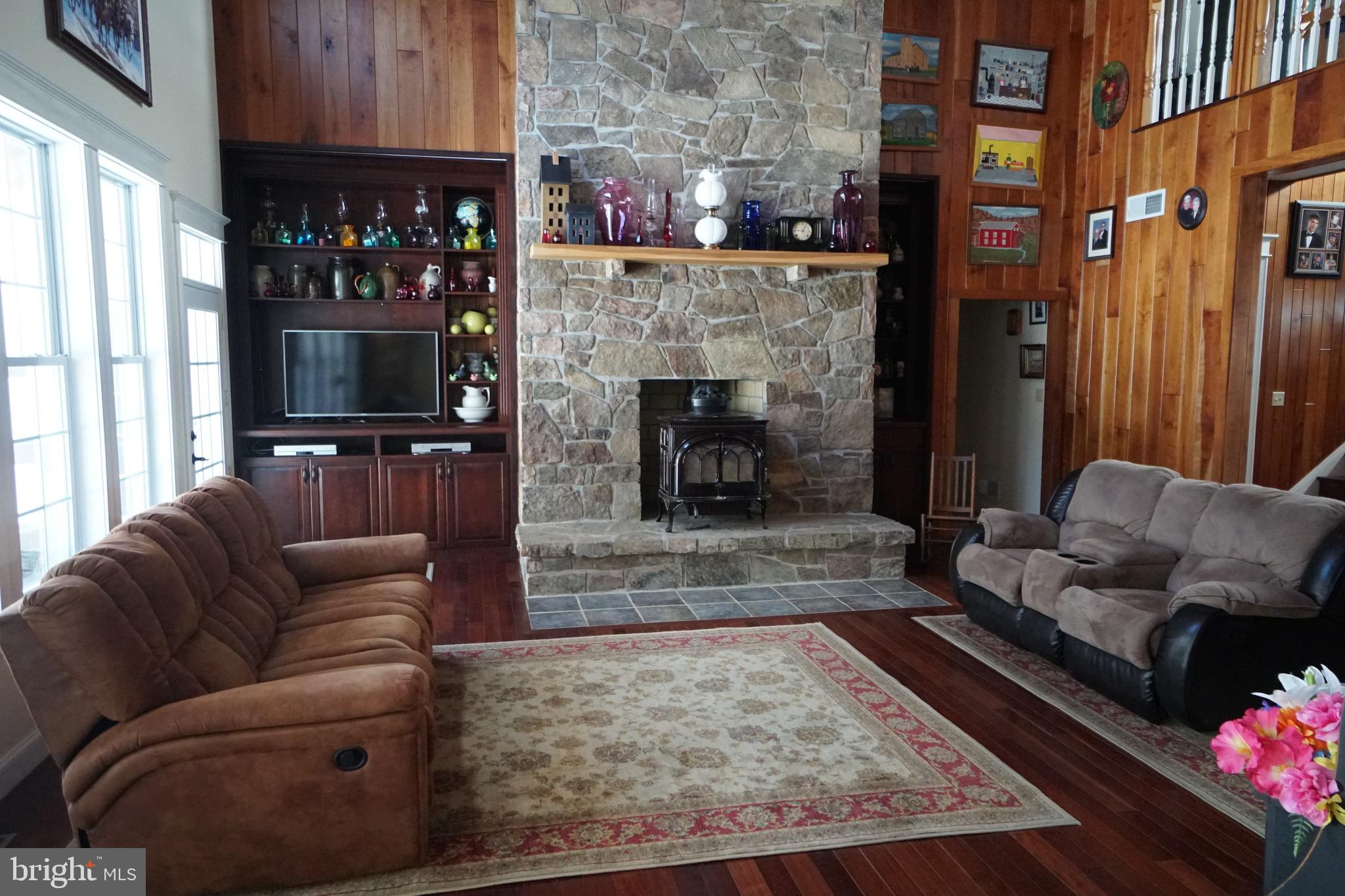 255 Troublesome Valley Road Franklin, WV 26807 - Photo 2 of 72 a living room with furniture and a fireplace