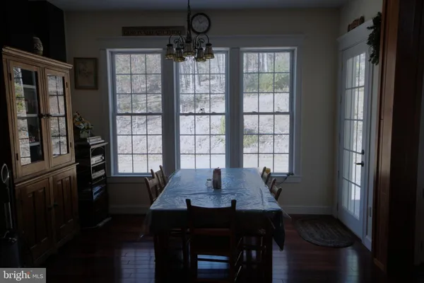 a kitchen with sink a refrigerator and cabinets