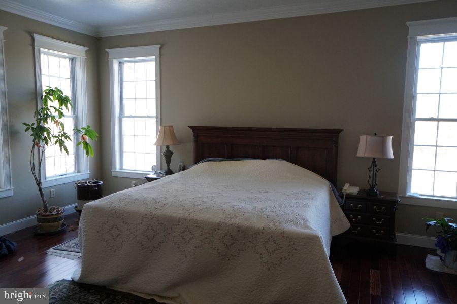 255 Troublesome Valley Road Franklin, WV 26807 - Photo 33 of 72 a bedroom with a bed and a window
