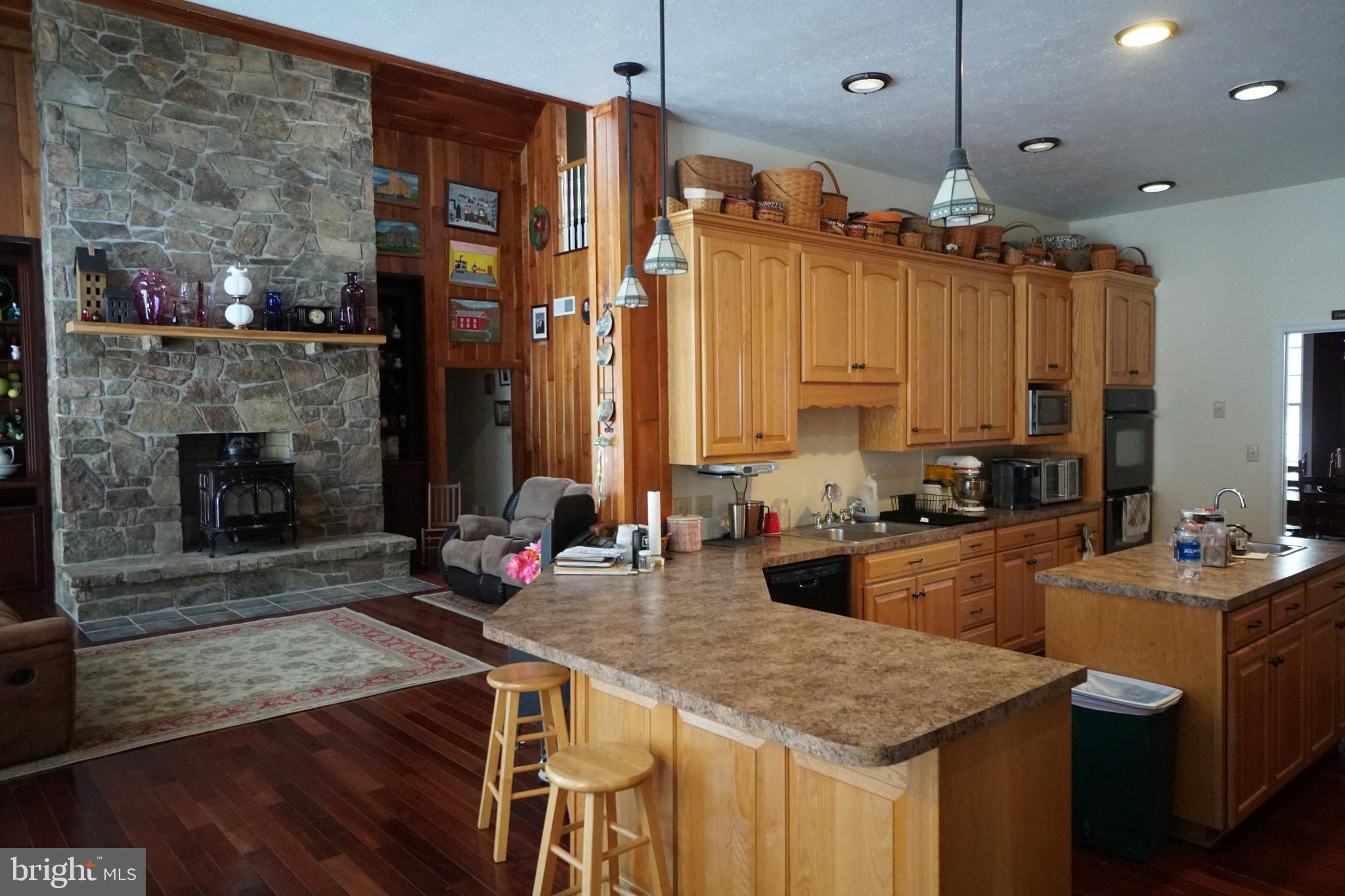 255 Troublesome Valley Road Franklin, WV 26807 - Photo 4 of 72 a kitchen with sink refrigerator and stove