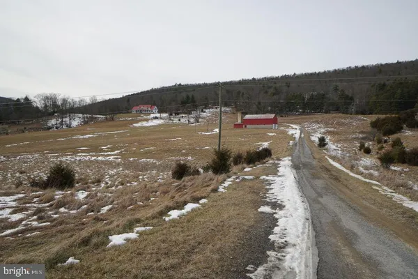 a view of a town with mountains in the background
