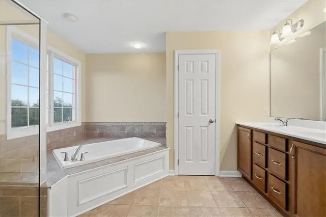 a bathroom with a bathtub and a sink