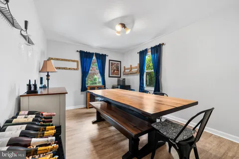 a room with furniture pool table and windows