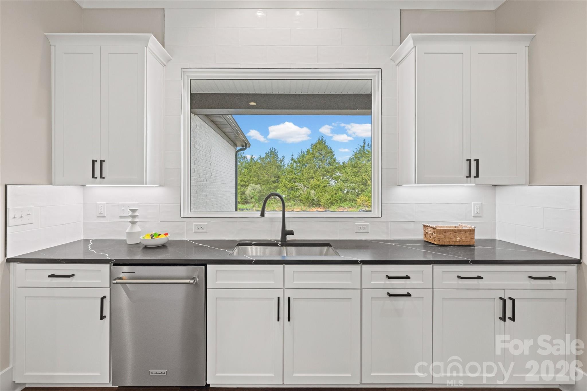 254 Triple Ponds Court Clover, SC 29710 - Photo 15 of 45 a kitchen with granite countertop white cabinets and a window