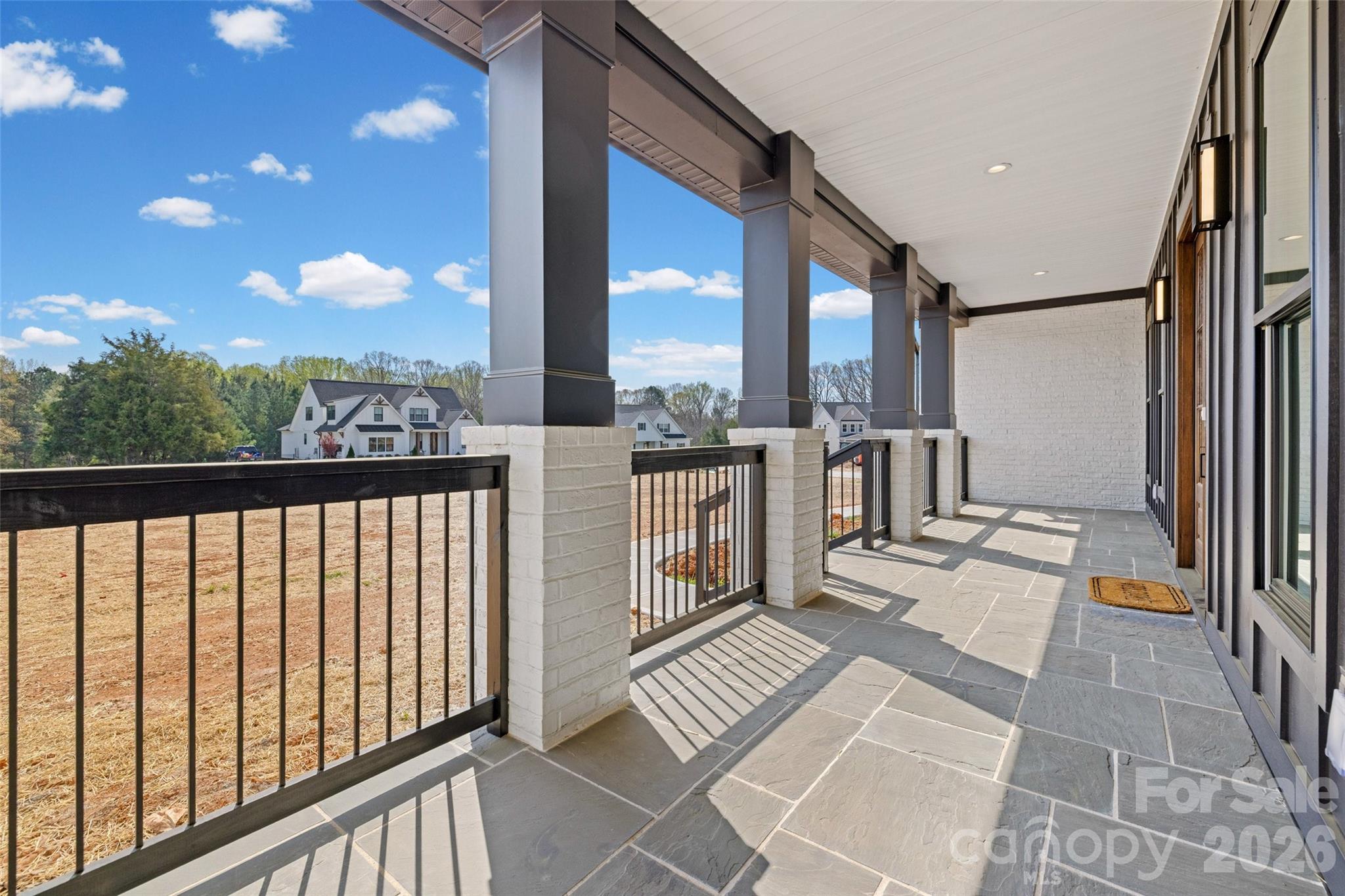 254 Triple Ponds Court Clover, SC 29710 - Photo 3 of 45 a view of balcony with floor to ceiling windows with wooden floor