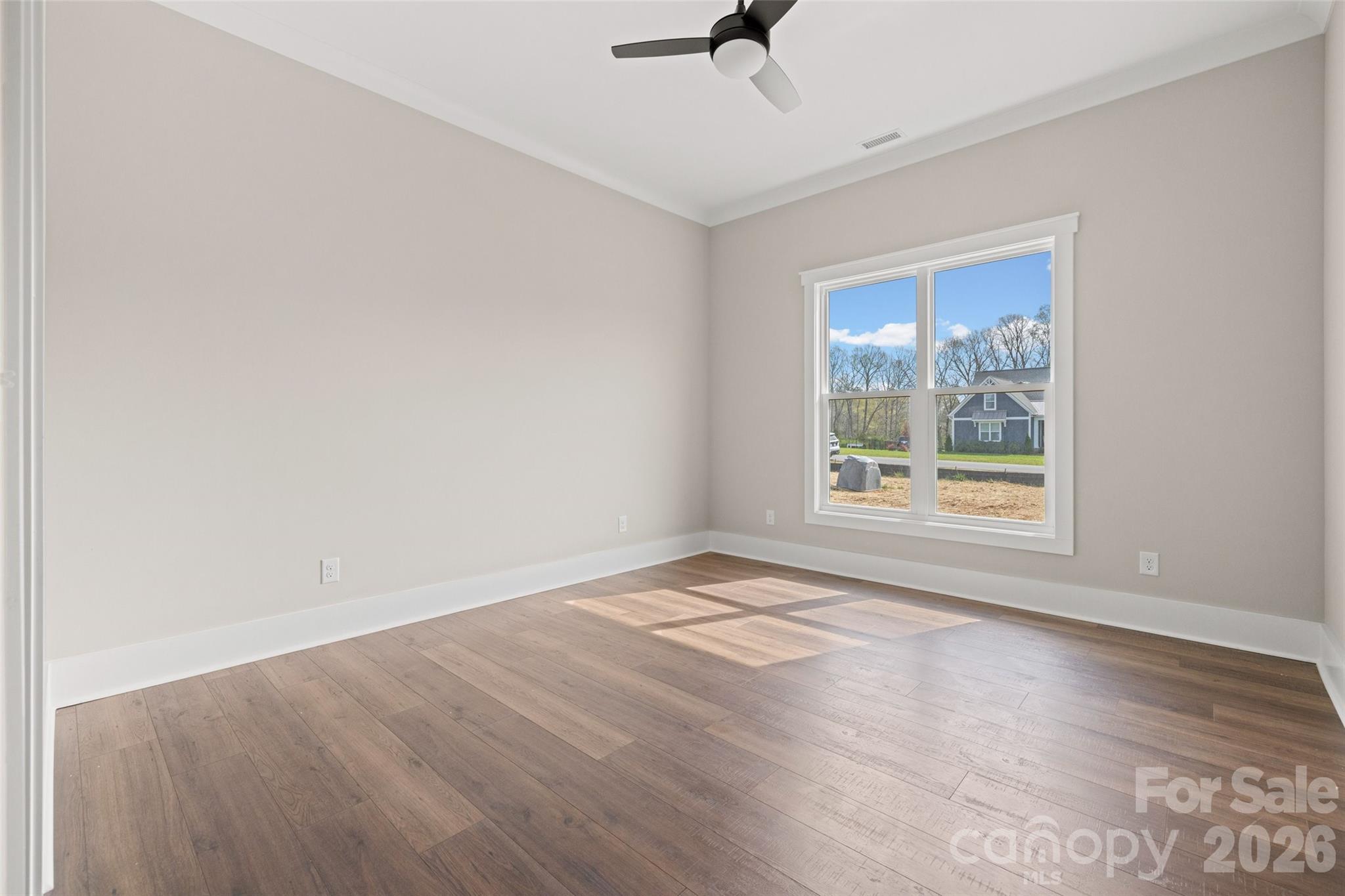 254 Triple Ponds Court Clover, SC 29710 - Photo 34 of 45 wooden floor in an empty room with a window
