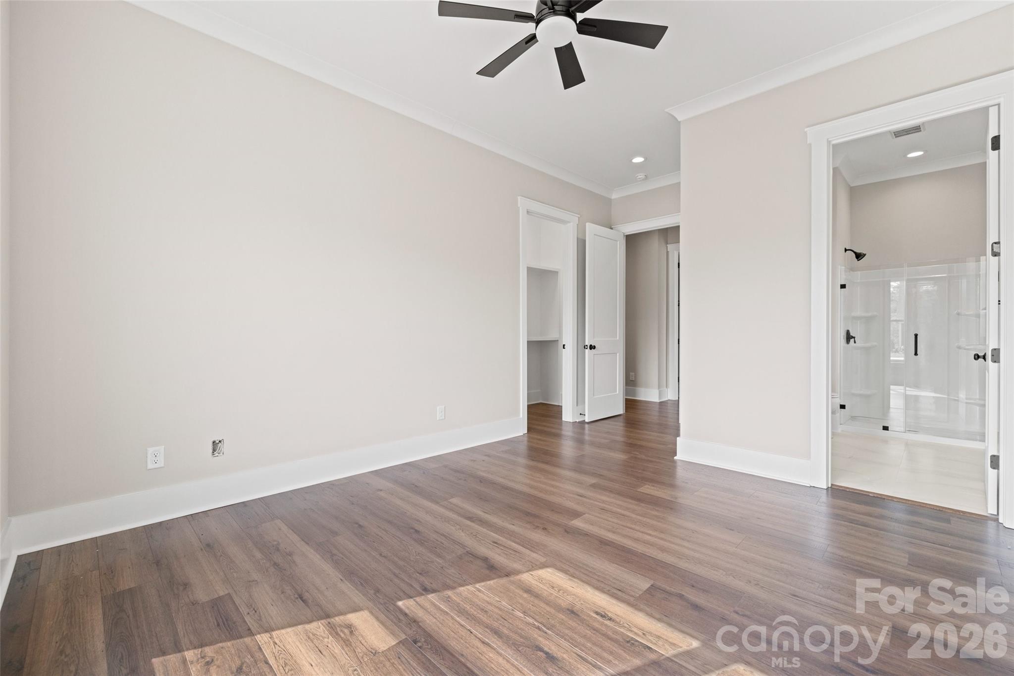 254 Triple Ponds Court Clover, SC 29710 - Photo 36 of 45 an empty room with wooden floor and windows