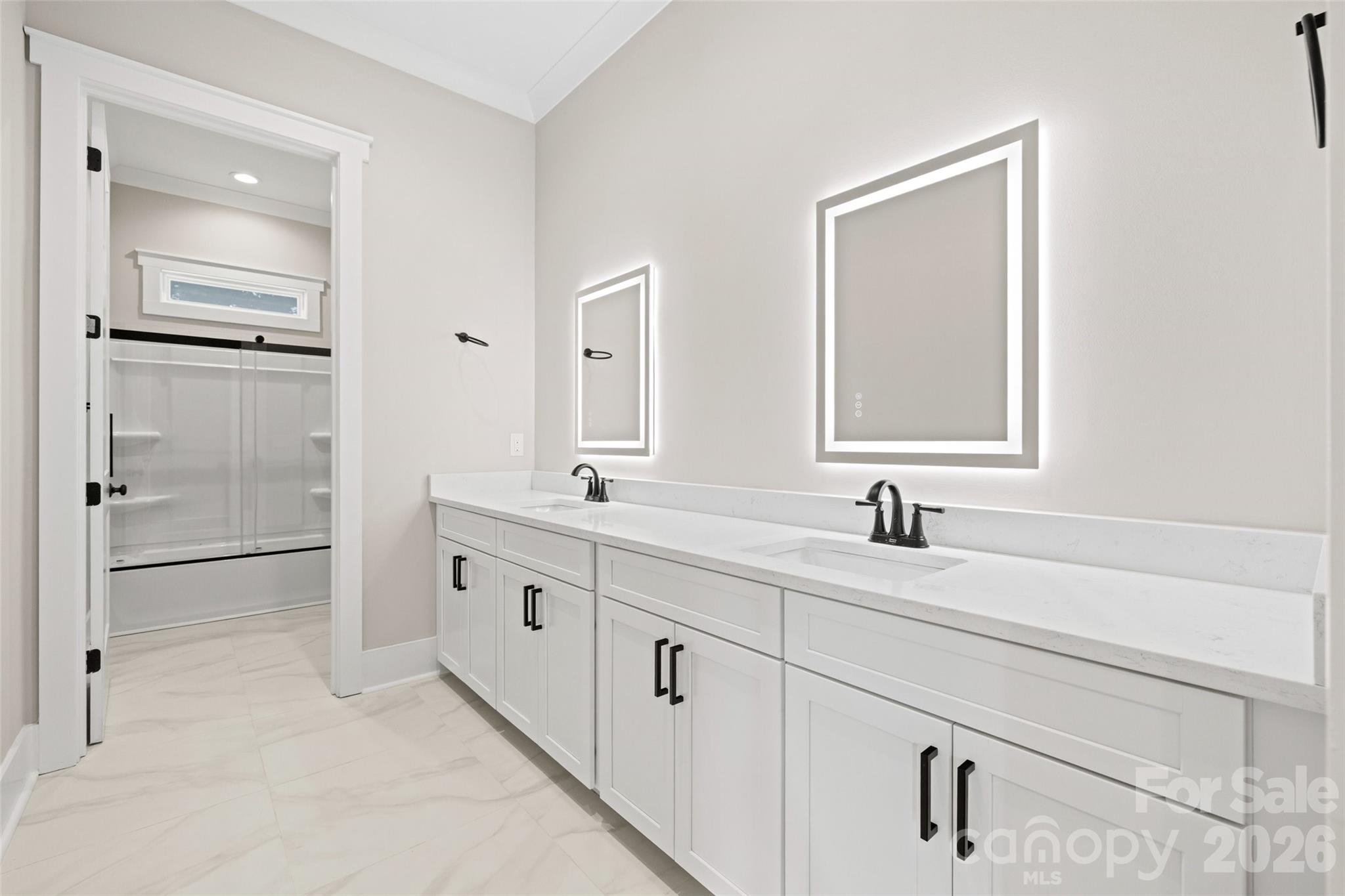 254 Triple Ponds Court Clover, SC 29710 - Photo 38 of 45 a bathroom with a double vanity sink and mirror