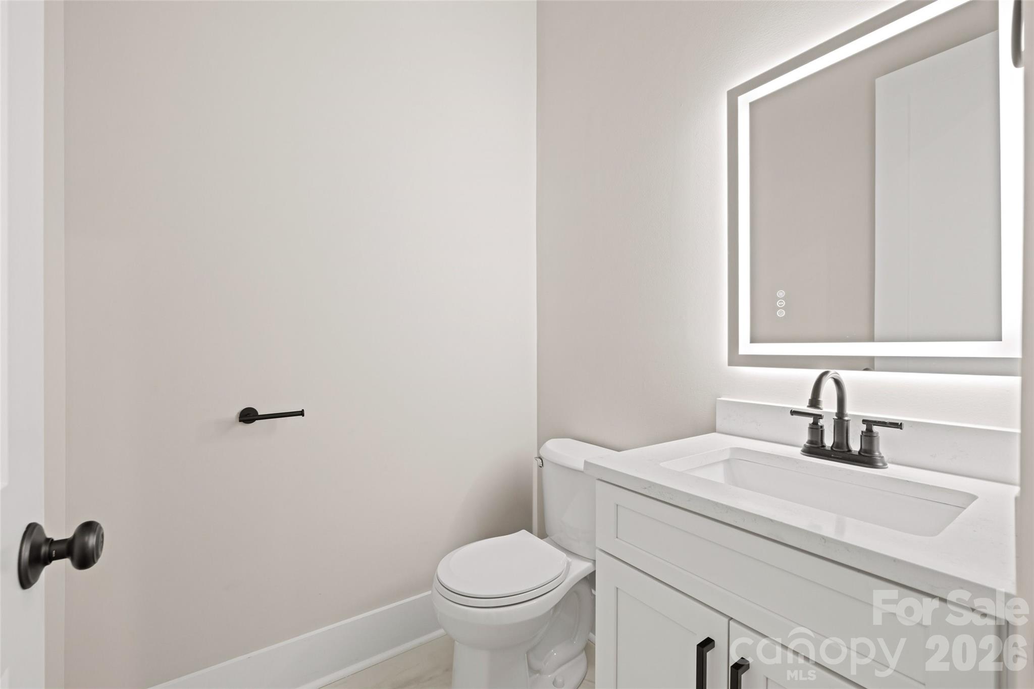 254 Triple Ponds Court Clover, SC 29710 - Photo 39 of 45 a bathroom with a toilet sink and mirror