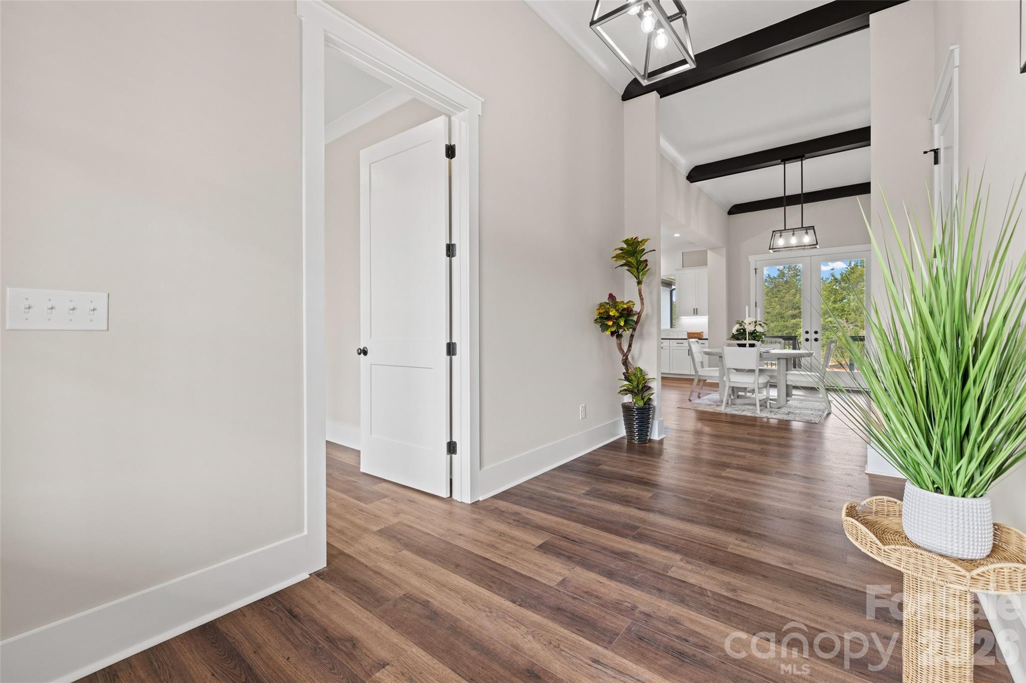 254 Triple Ponds Court Clover, SC 29710 - Photo 6 of 45 a view of a hallway view with wooden floor and a potted plant
